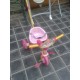 Triciclo rosa con palo